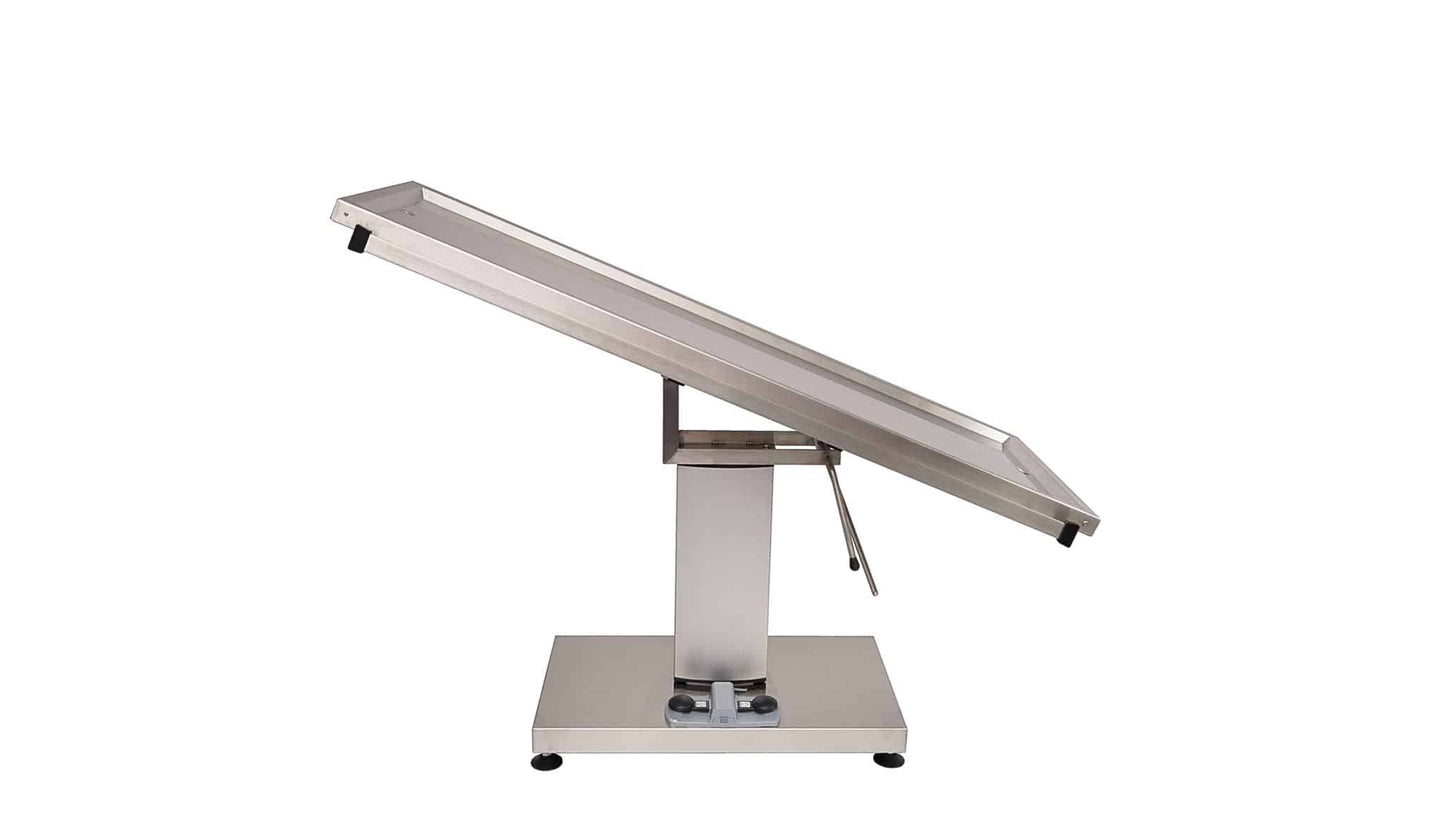Surgery table with central electric column and two evacuation holes