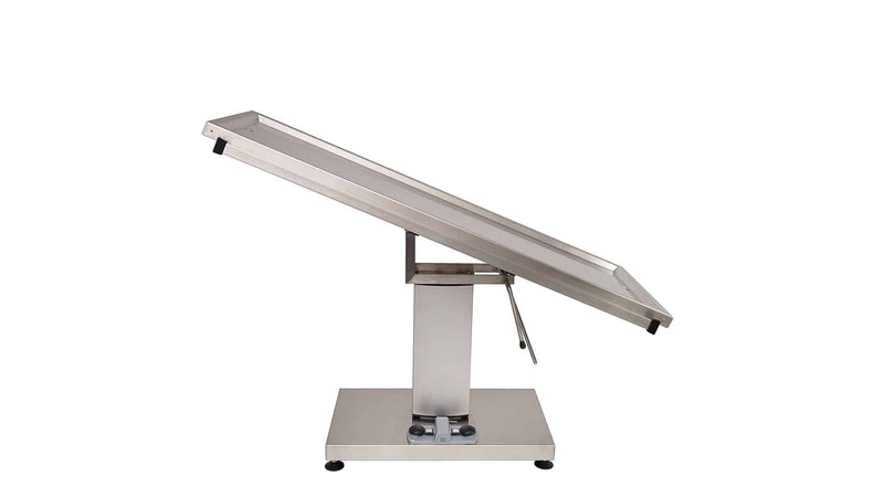 Surgery table with central electric column and two evacuation holes