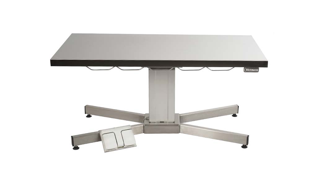 Examination table with central electric column and flat top