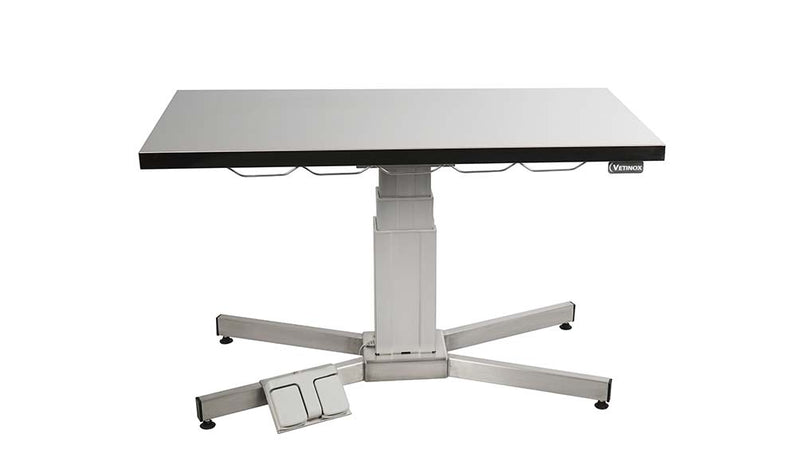 Examination table with central electric column and flat top